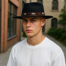 Load image into Gallery viewer, Black Carlisle Hats Lucan Fedora made of leather, featuring a classic fedora style with a wide brim and a sleek, stylish appearance.