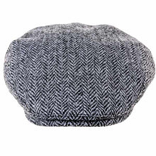 Load image into Gallery viewer, Highland Harris Tweed flat cap by Carlisle Hats, showcasing a classic textured wool cap with a curved brim and traditional style.